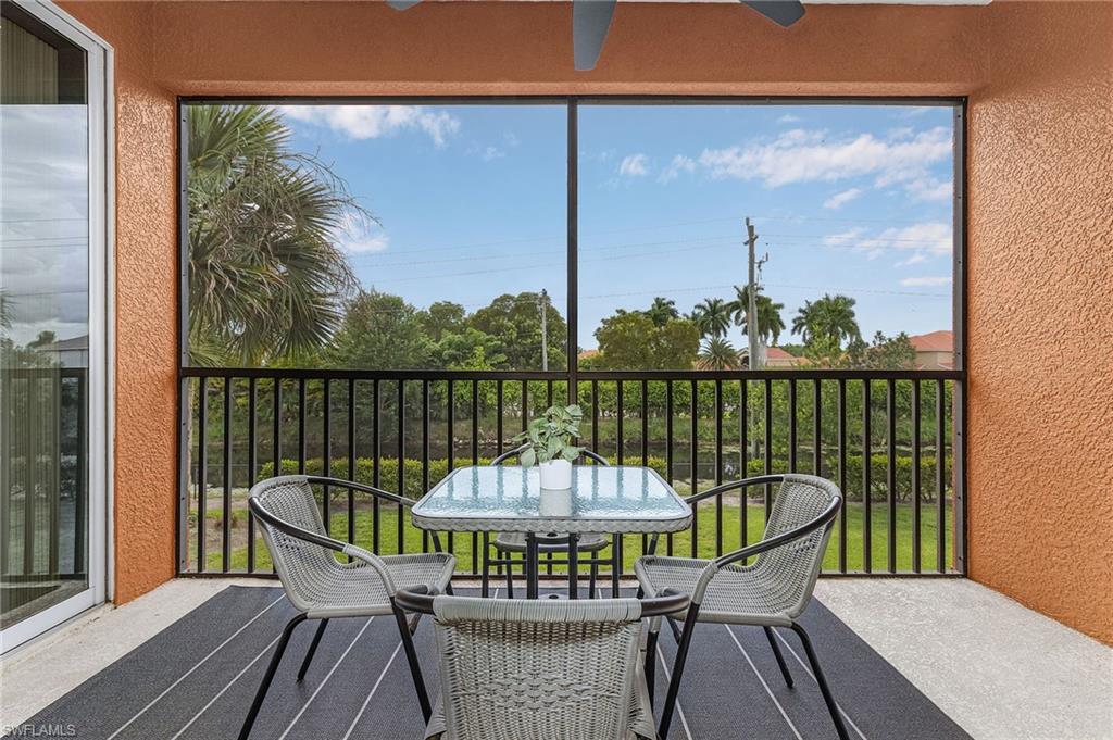 10045 Heather Lane, Unit 203 Naples, FL 34119 - Photo 17 of 30 a view of a chair in wooden deck