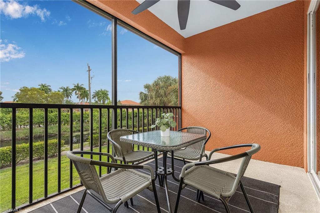 10045 Heather Lane, Unit 203 Naples, FL 34119 - Photo 18 of 30 a view of a chairs and table in the balcony