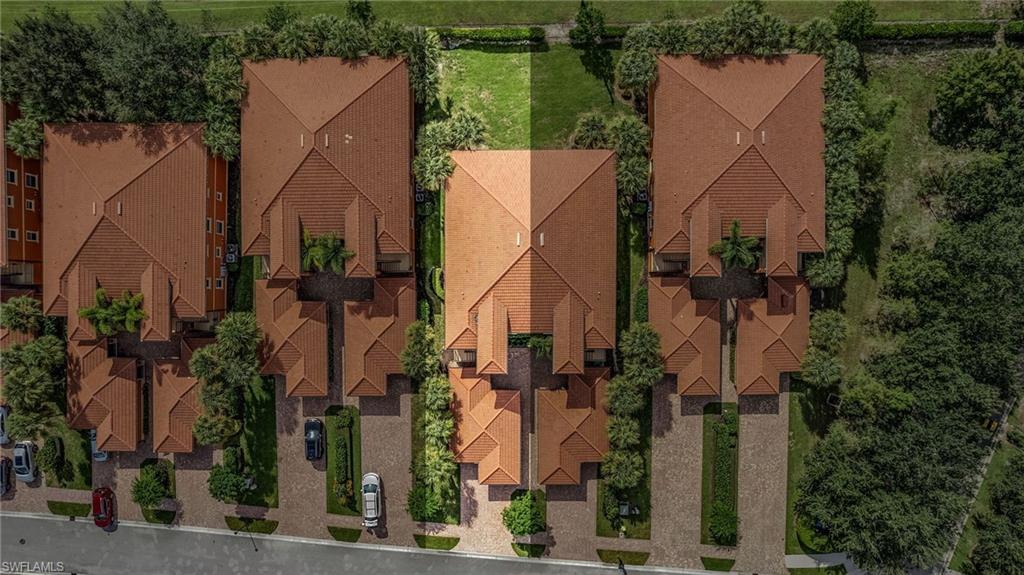 10045 Heather Lane, Unit 203 Naples, FL 34119 - Photo 20 of 30 an aerial view of a house with a yard and large tree