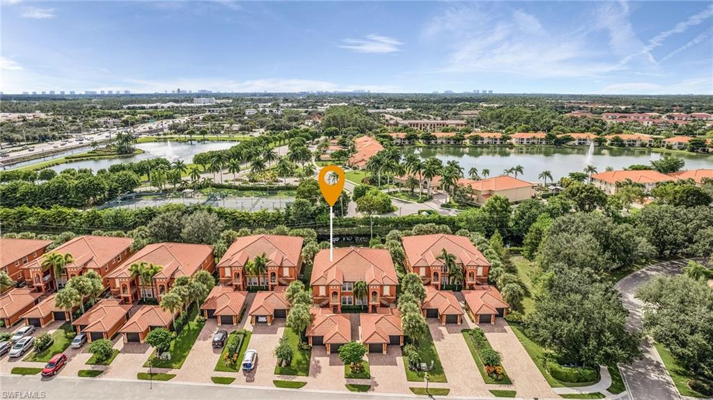 10045 Heather Lane, Unit 203 Naples, FL 34119 - Photo 22 of 30 a view of a city with lots of residential buildings and mountain in the background