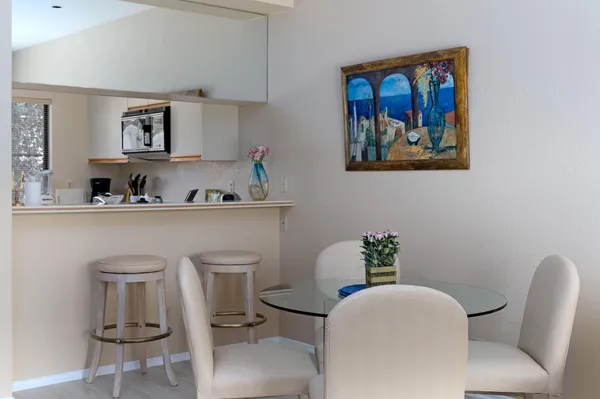 a dining room with furniture and window