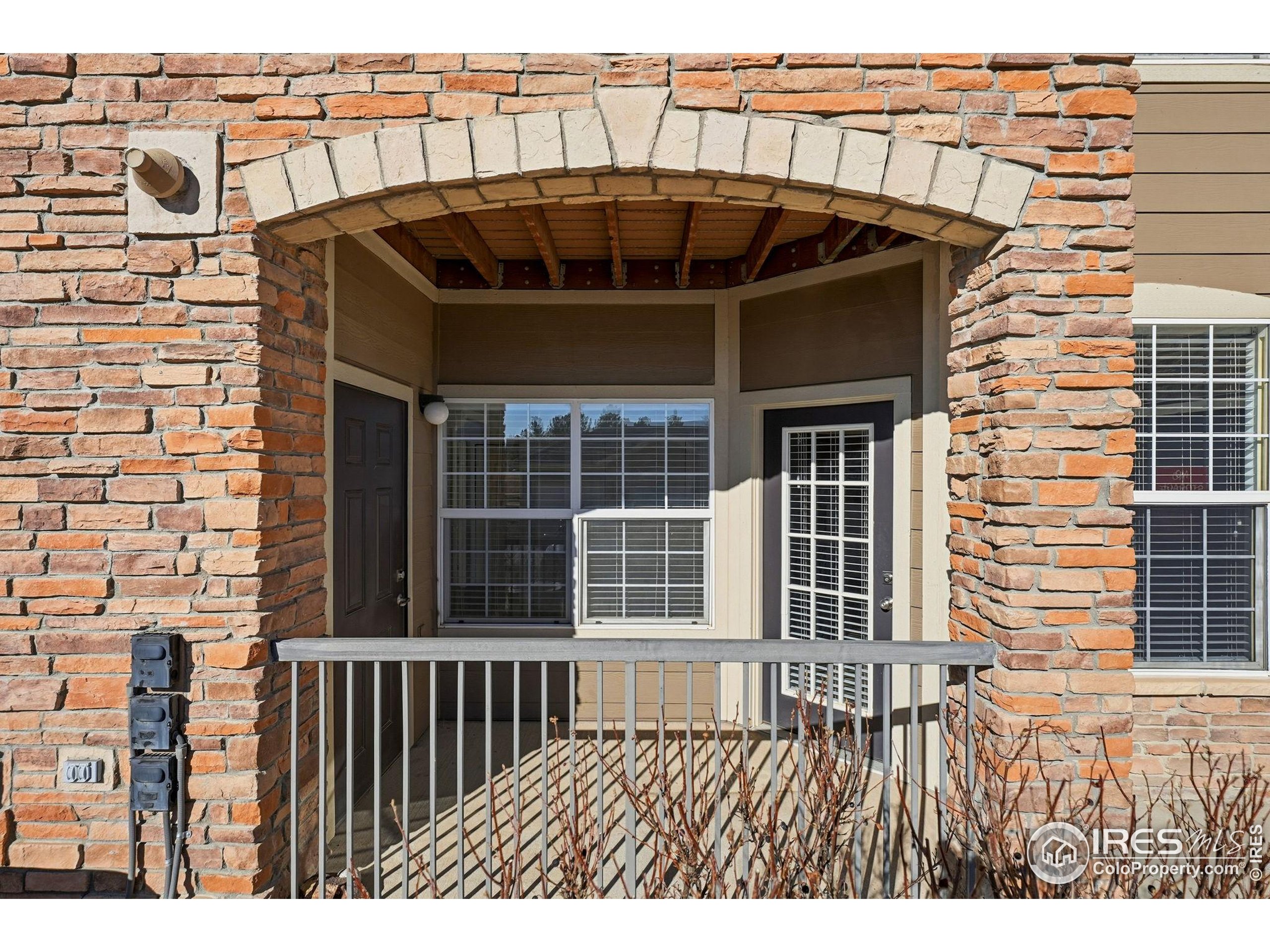 1425 Blue Sky Circle, Unit 15105 Erie, CO 80516 - Photo 16 of 45 a front view of a house with wooden deck