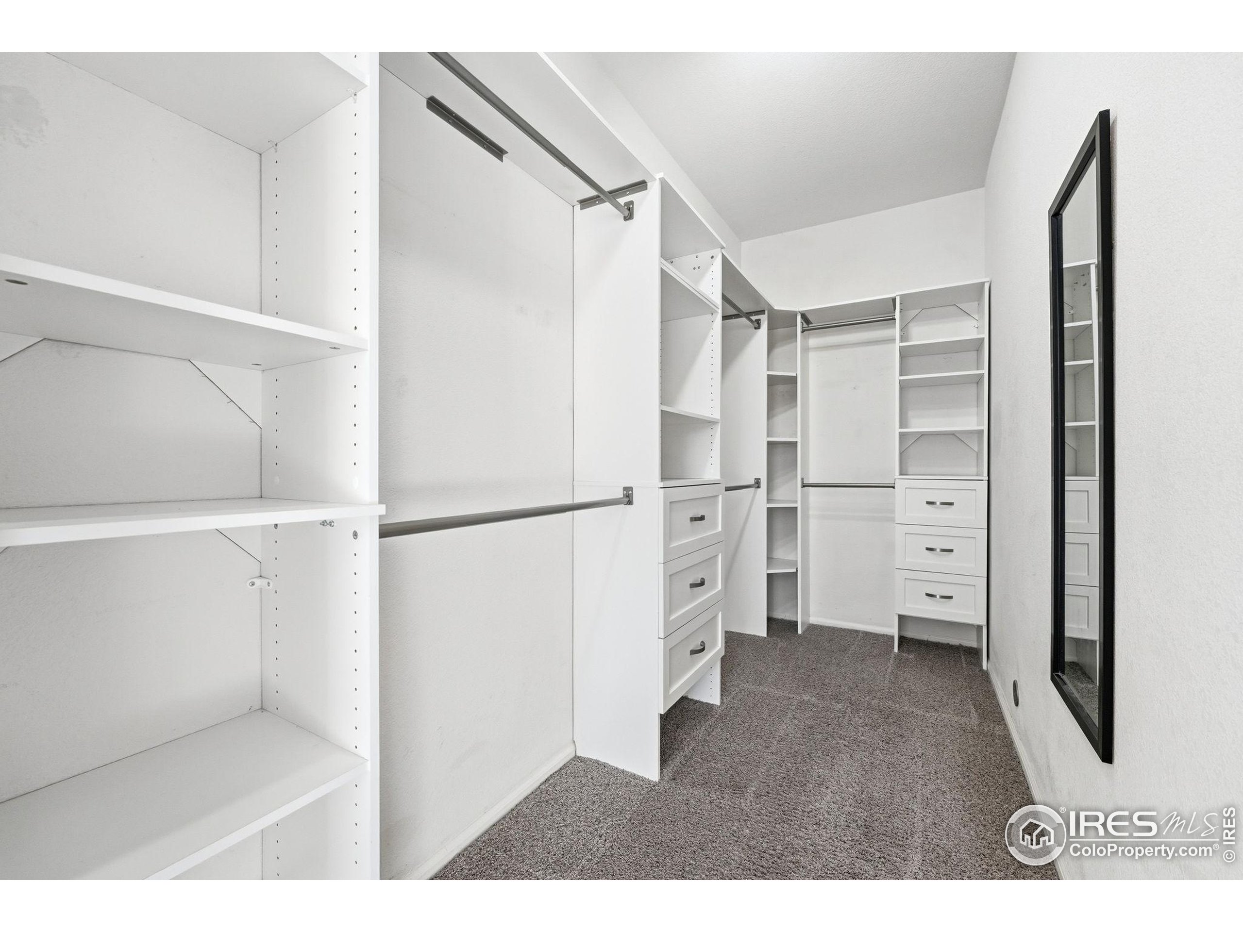 1425 Blue Sky Circle, Unit 15105 Erie, CO 80516 - Photo 26 of 45 a view of walk in closet with empty racks