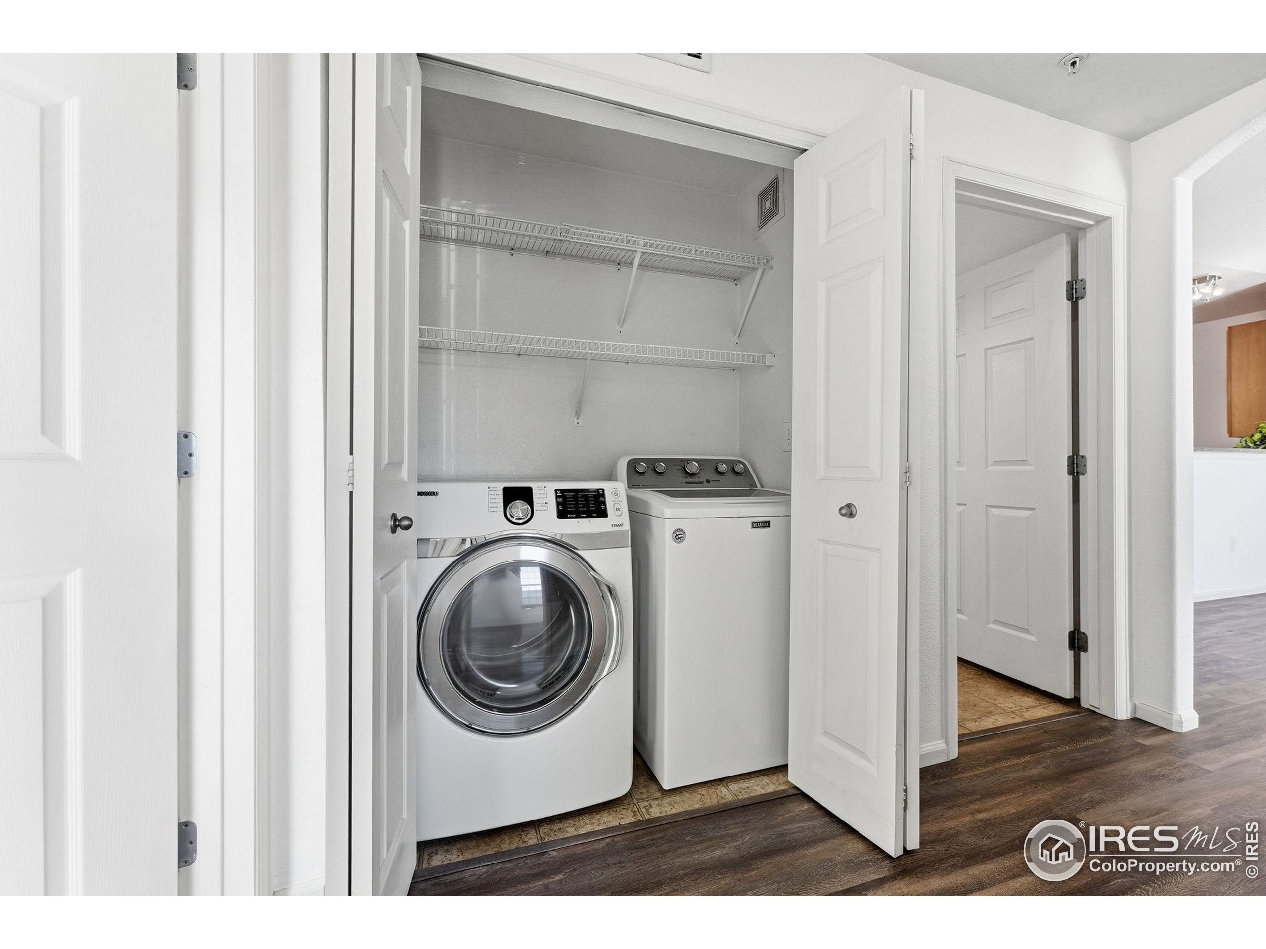 1425 Blue Sky Circle, Unit 15105 Erie, CO 80516 - Photo 33 of 45 a utility room with dryer and washer