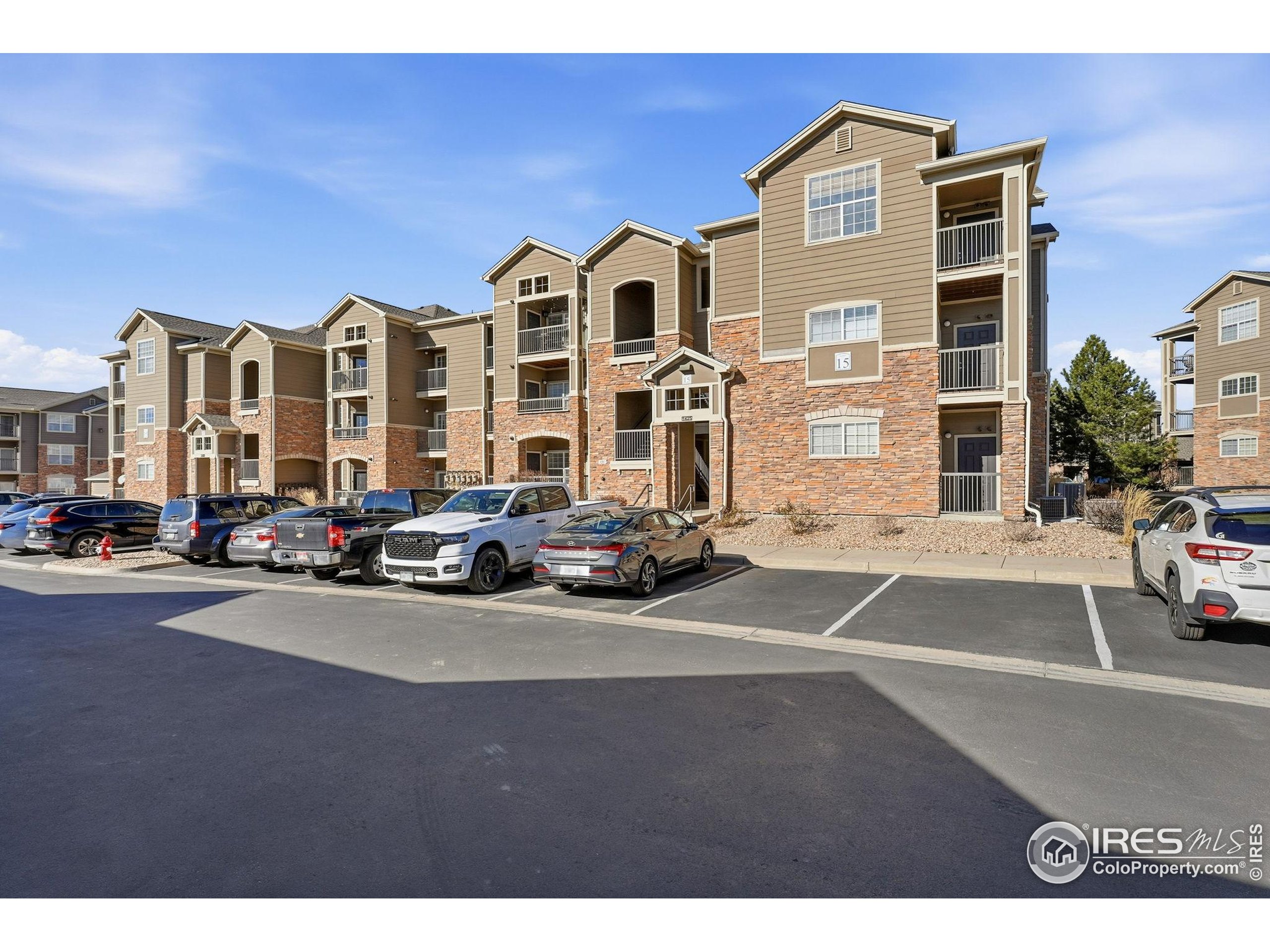 1425 Blue Sky Circle, Unit 15105 Erie, CO 80516 - Photo 39 of 45 a view of a street with cars