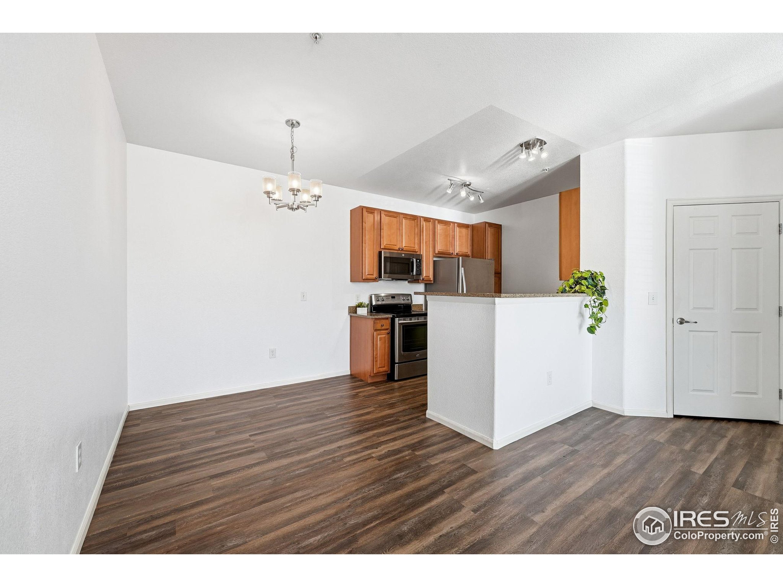1425 Blue Sky Circle, Unit 15105 Erie, CO 80516 - Photo 8 of 45 a view interior of a kitchen with refrigerator and microwave