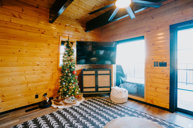 1413 Basel Drive Midway, UT 84049 - Photo 13 of 137 Sitting room with wooden walls, wood finished floors, ceiling fan, and a wooden ceiling with exposed beams