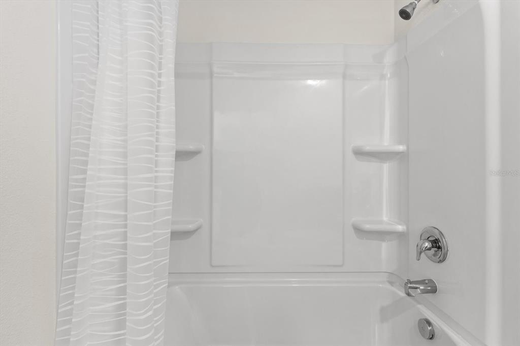 13691 Southwest 69th Terrace Ocala, FL 34473 - Photo 20 of 44 a bathroom with a bathtub