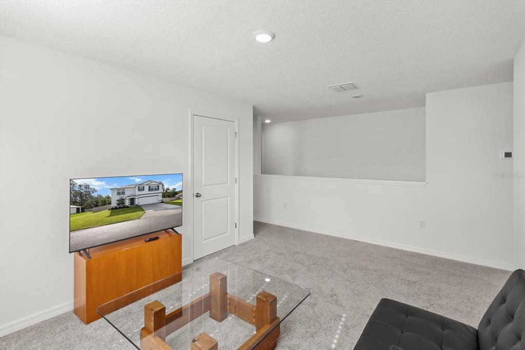 13691 Southwest 69th Terrace Ocala, FL 34473 - Photo 29 of 44 a kitchen with a refrigerator and stove