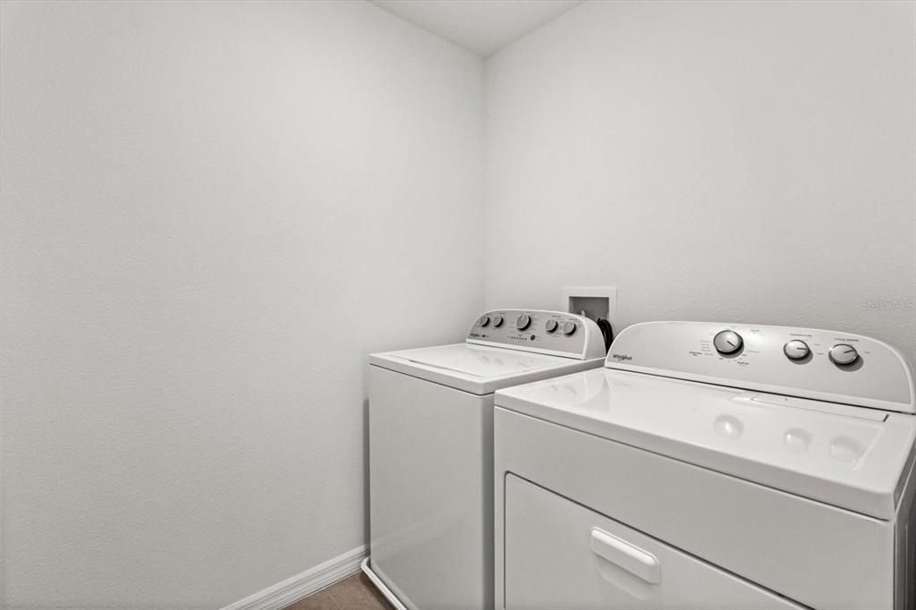 13691 Southwest 69th Terrace Ocala, FL 34473 - Photo 36 of 44 a utility room with dryer and washer