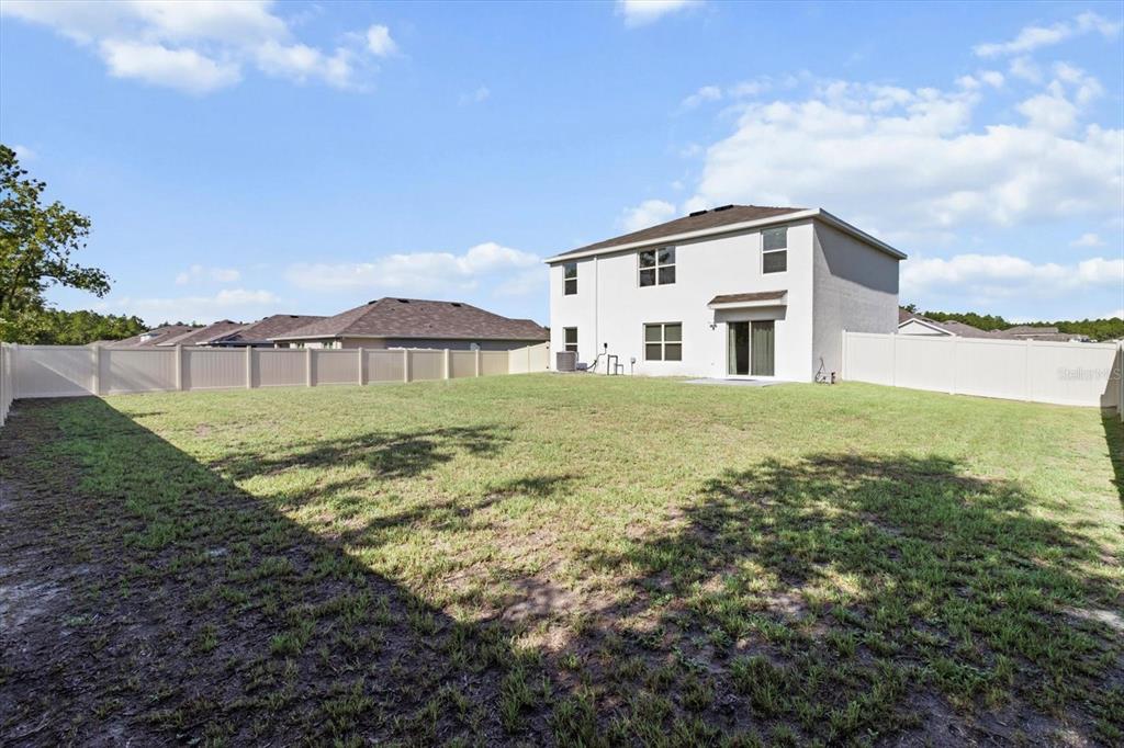 13691 Southwest 69th Terrace Ocala, FL 34473 - Photo 39 of 44 a house view with a garden space