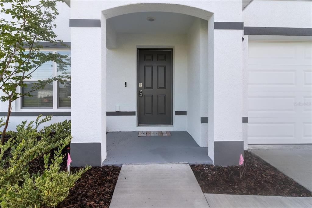 13691 Southwest 69th Terrace Ocala, FL 34473 - Photo 5 of 44 a view of a entryway door front of house