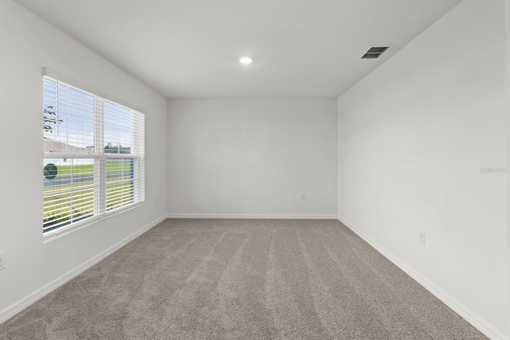 13691 Southwest 69th Terrace Ocala, FL 34473 - Photo 7 of 44 a view of an empty room with a window