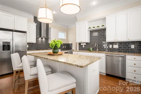 a kitchen with stainless steel appliances granite countertop counter space a sink cabinets and appliances
