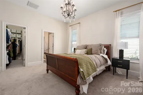 a bedroom with a bed and a table