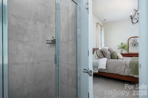 a bedroom with a bed and a table
