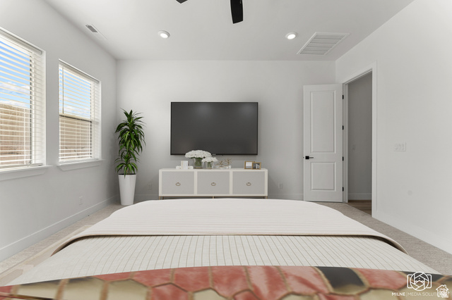 707 Spring Lily Drive St. George, UT 84790 - Photo 22 of 43 Spacious room featuring dual windows with blinds, recessed lighting, ceiling fan, and carpeted flooring
