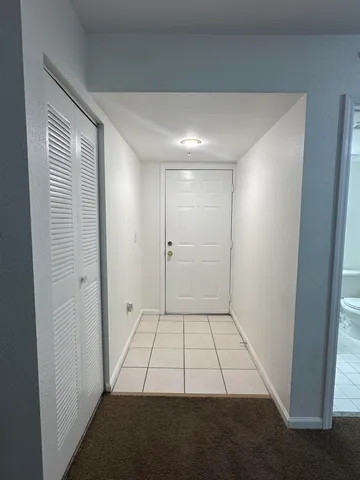 a view of an empty room and window