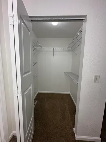 a view of a swimming pool with a table and chairs