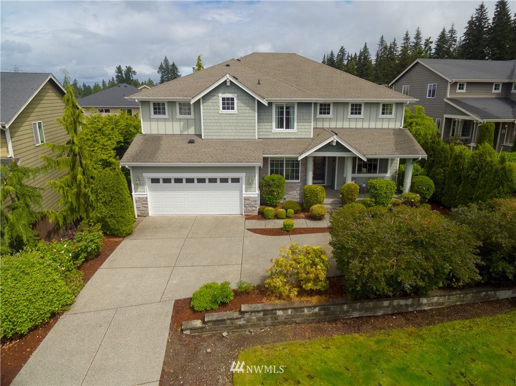 4407 219th Street Southeast Bothell, WA 98021 - Photo 1 of 33 a front view of a house with a yard
