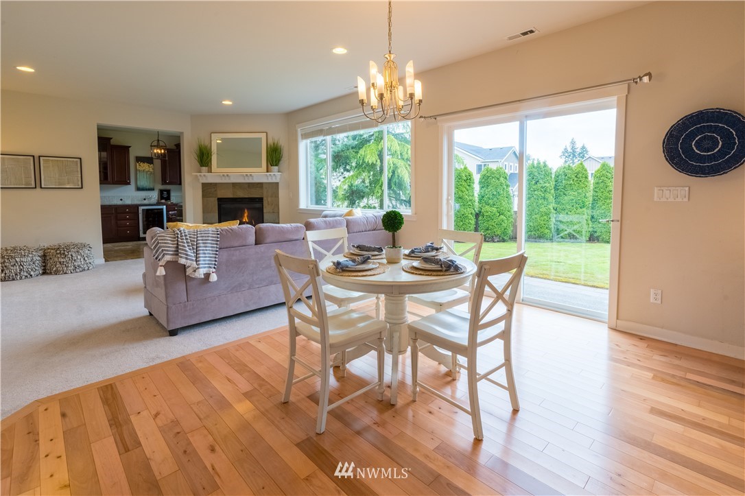 4407 219th Street Southeast Bothell, WA 98021 - Photo 14 of 33 a view of a dining room with furniture window and outside view