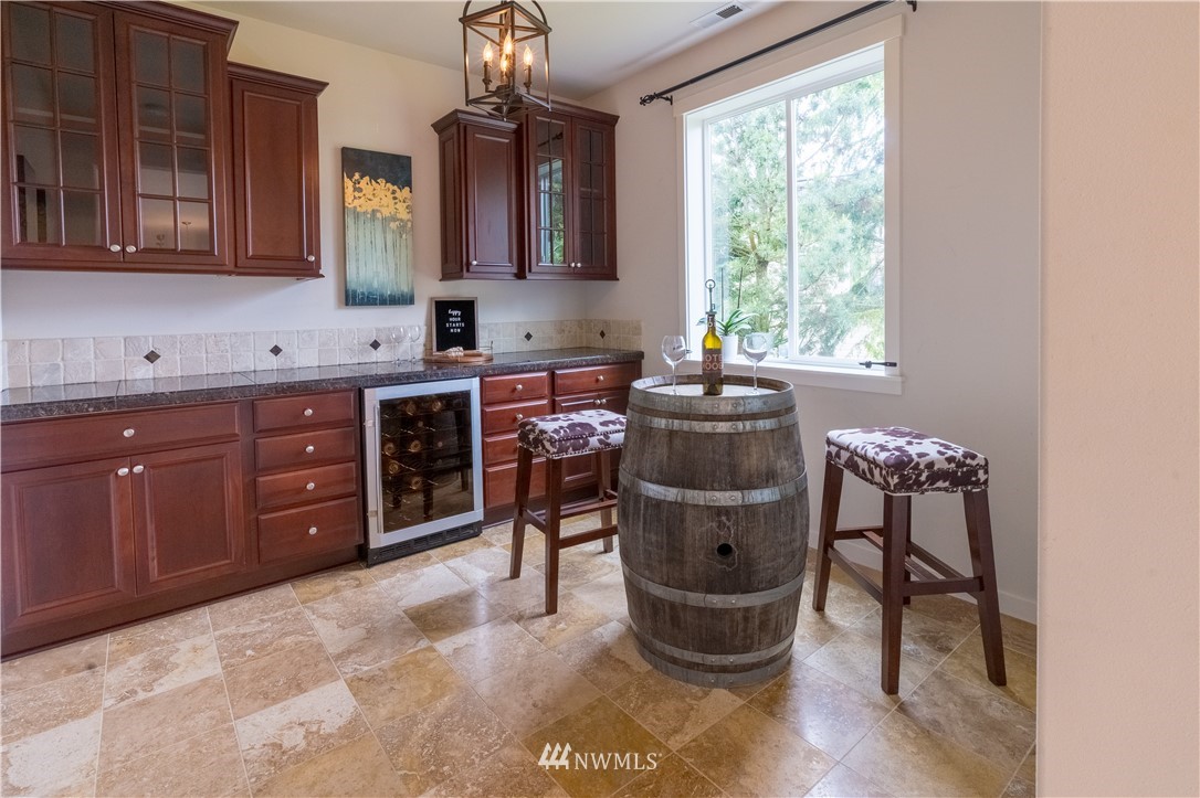 4407 219th Street Southeast Bothell, WA 98021 - Photo 15 of 33 a kitchen with a stove a sink and a cabinets
