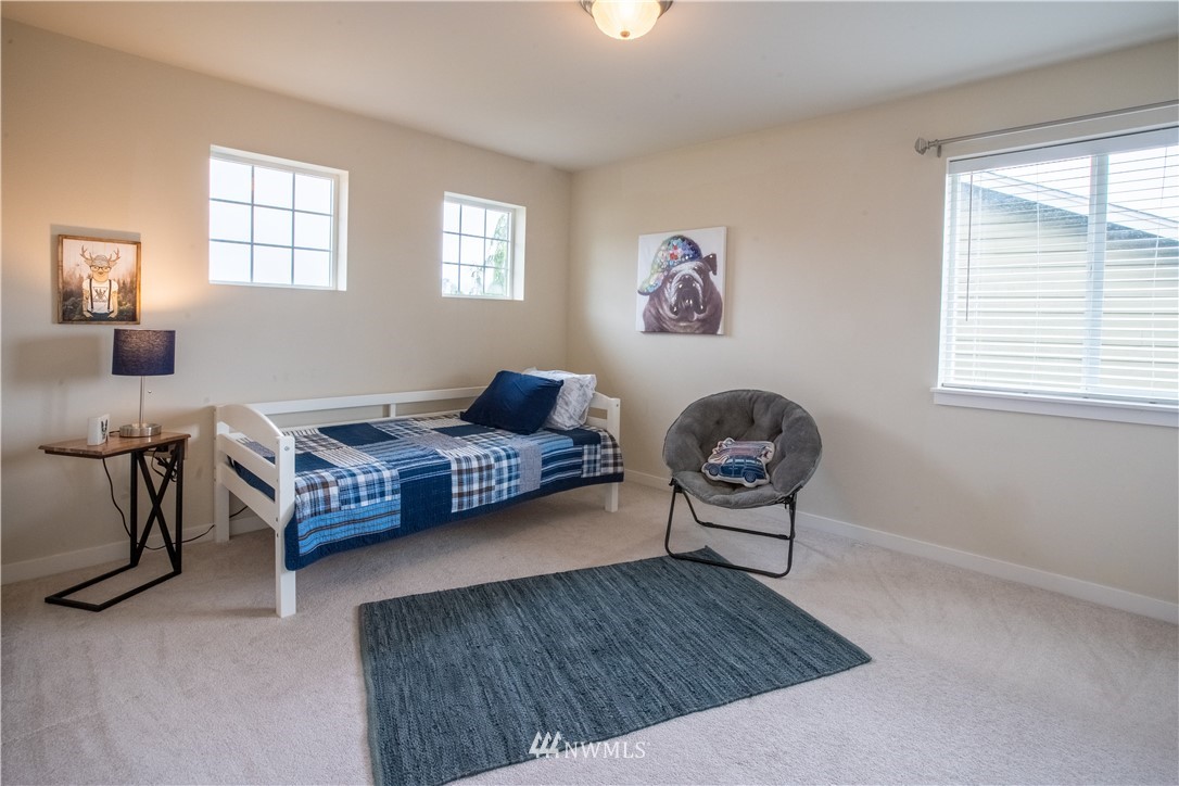 4407 219th Street Southeast Bothell, WA 98021 - Photo 19 of 33 a living room with furniture and a window