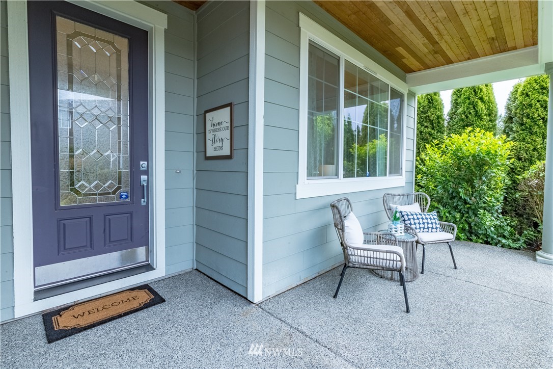 4407 219th Street Southeast Bothell, WA 98021 - Photo 3 of 33 a balcony with chairs and a gate