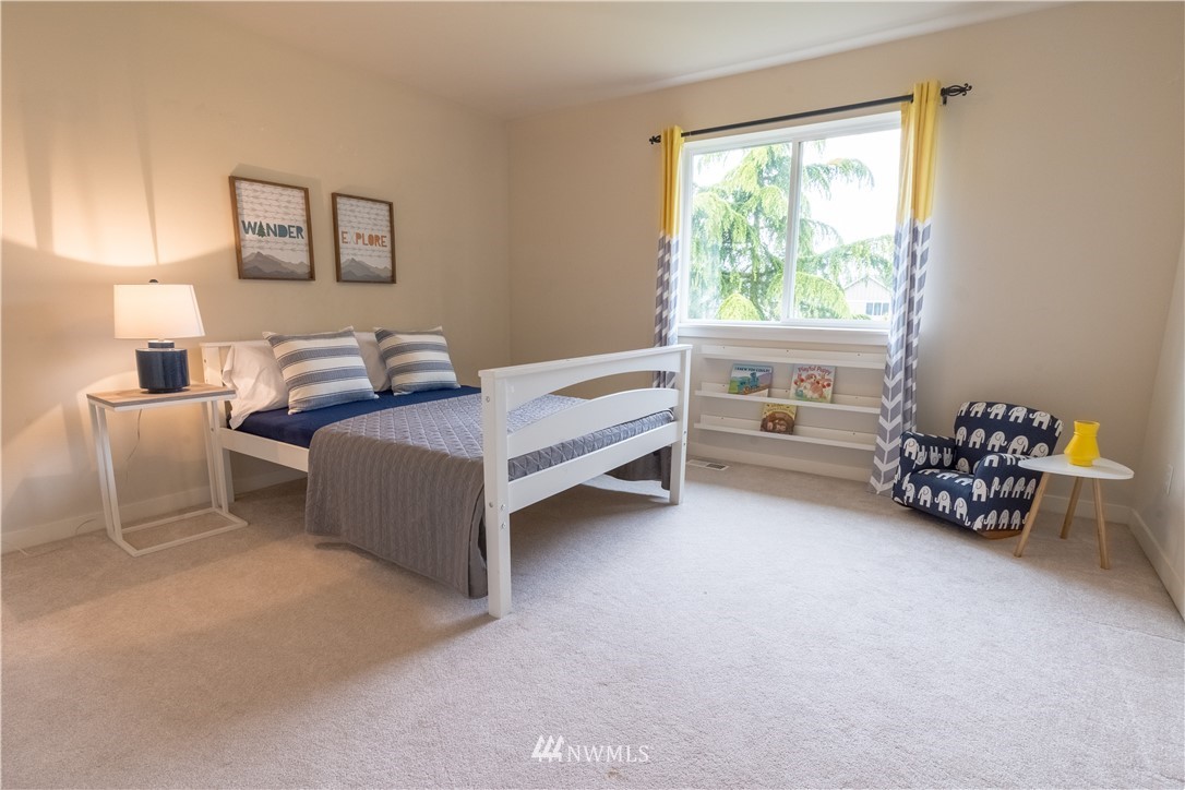 4407 219th Street Southeast Bothell, WA 98021 - Photo 21 of 33 a bed room with furniture and a window