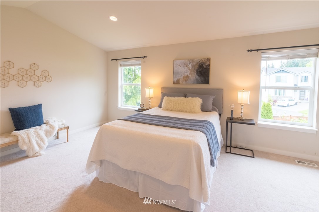 4407 219th Street Southeast Bothell, WA 98021 - Photo 23 of 33 a bedroom with a bed and a window