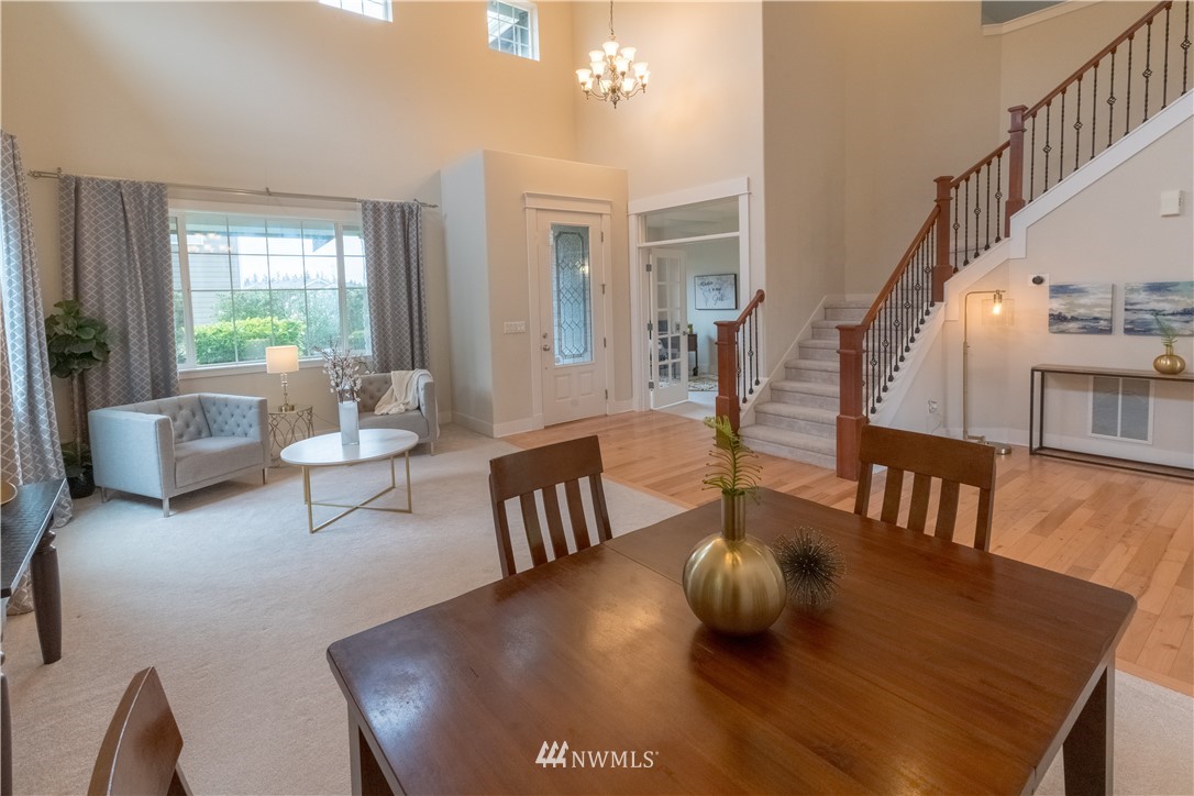 4407 219th Street Southeast Bothell, WA 98021 - Photo 7 of 33 a living room with furniture and a large window