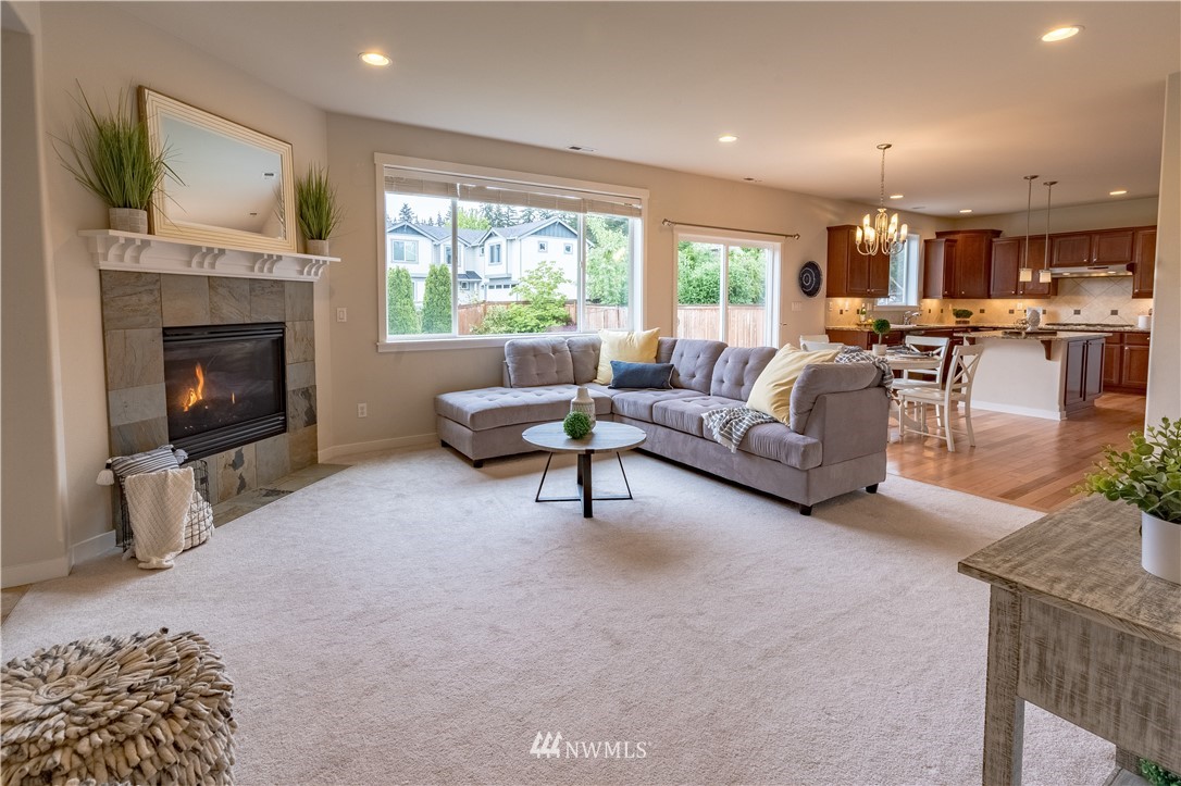 4407 219th Street Southeast Bothell, WA 98021 - Photo 10 of 33 a living room with furniture and a fireplace