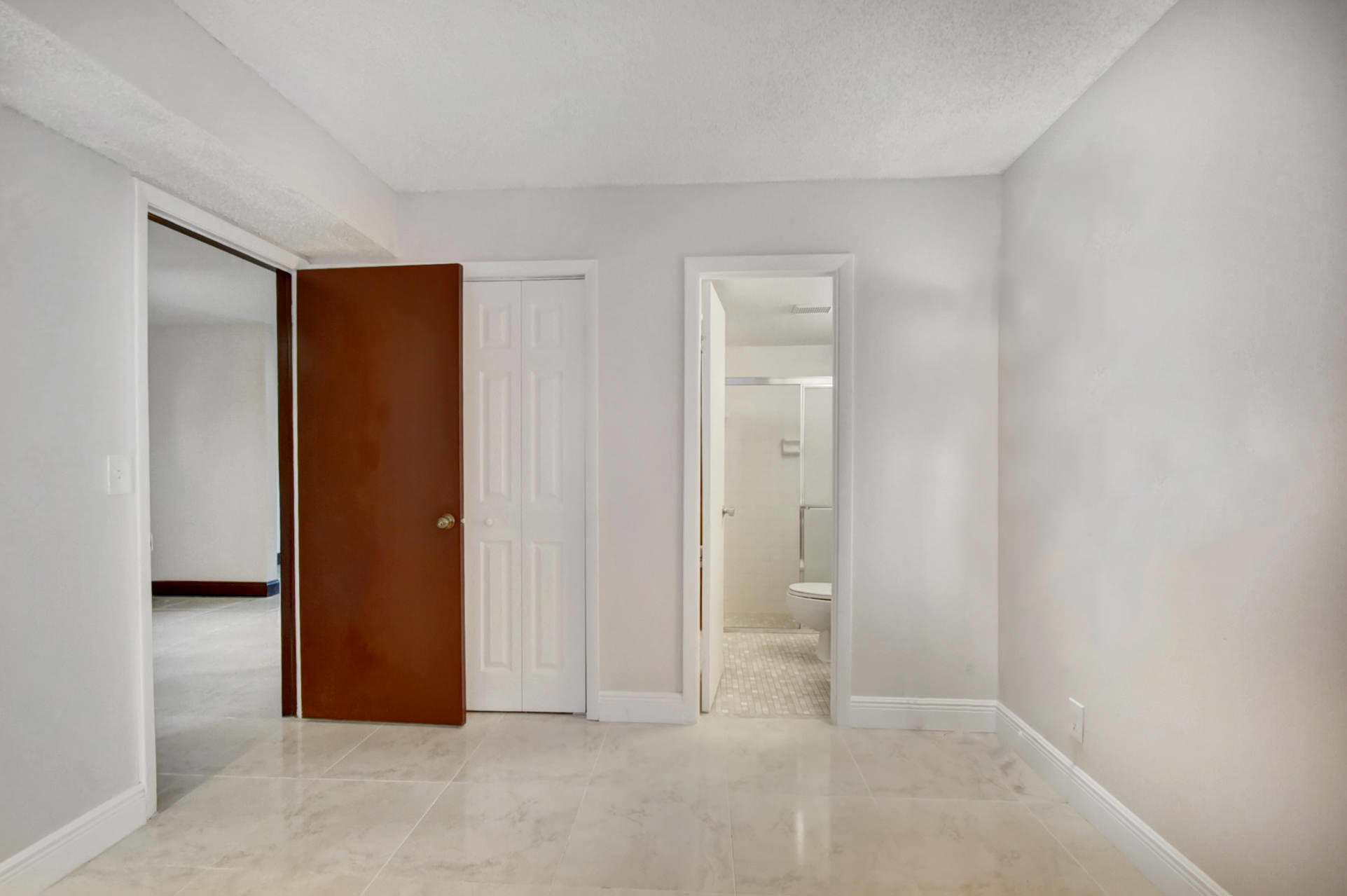 1845 Northwest 4th Avenue, Unit 16 Boca Raton, FL 33432 - Photo 18 of 37 a view of an empty room