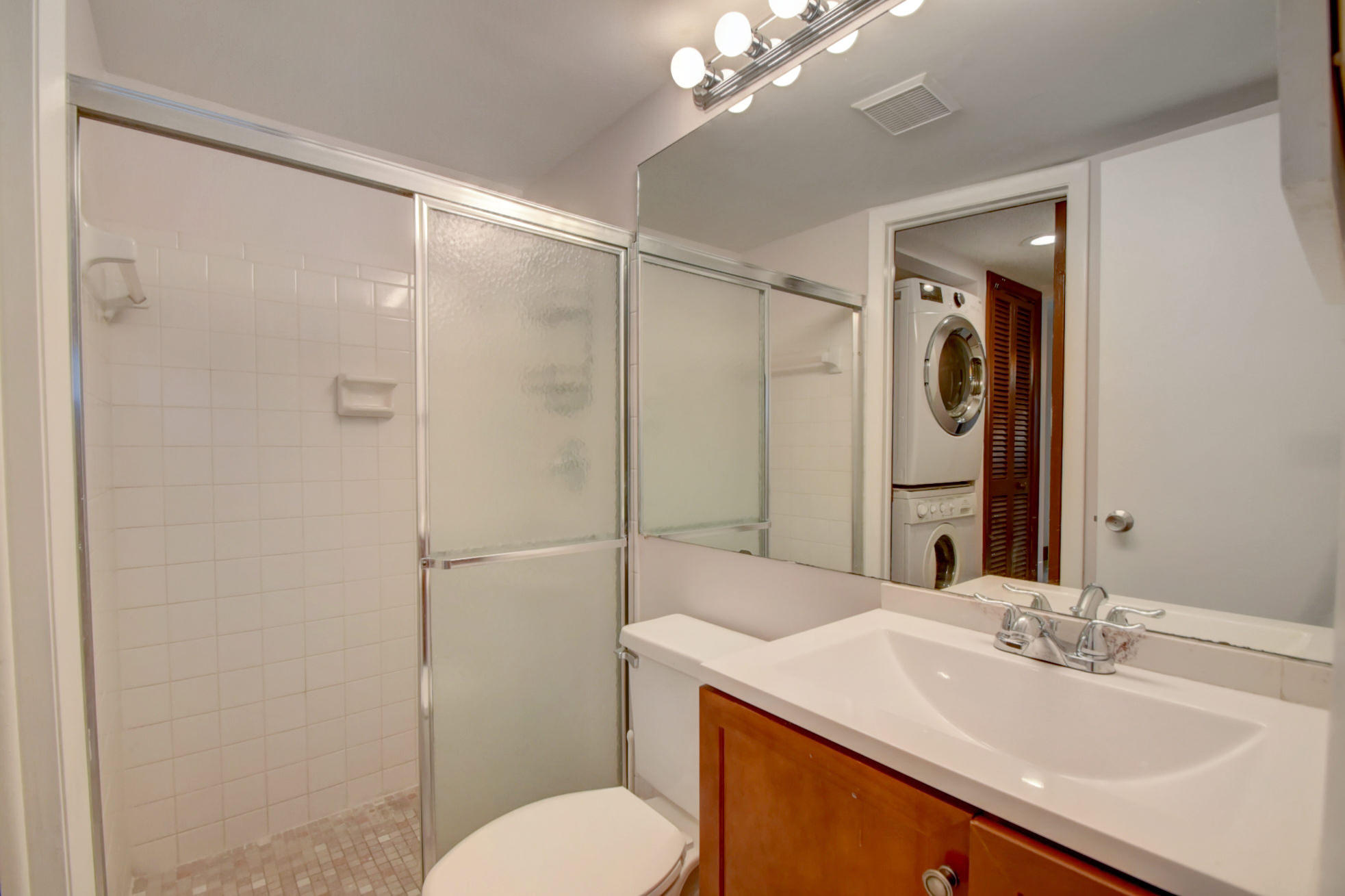 1845 Northwest 4th Avenue, Unit 16 Boca Raton, FL 33432 - Photo 19 of 37 a bathroom with a sink toilet and shower
