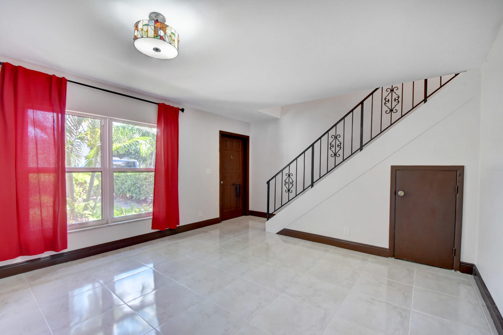 1845 Northwest 4th Avenue, Unit 16 Boca Raton, FL 33432 - Photo 2 of 37 a view of an empty room with a window