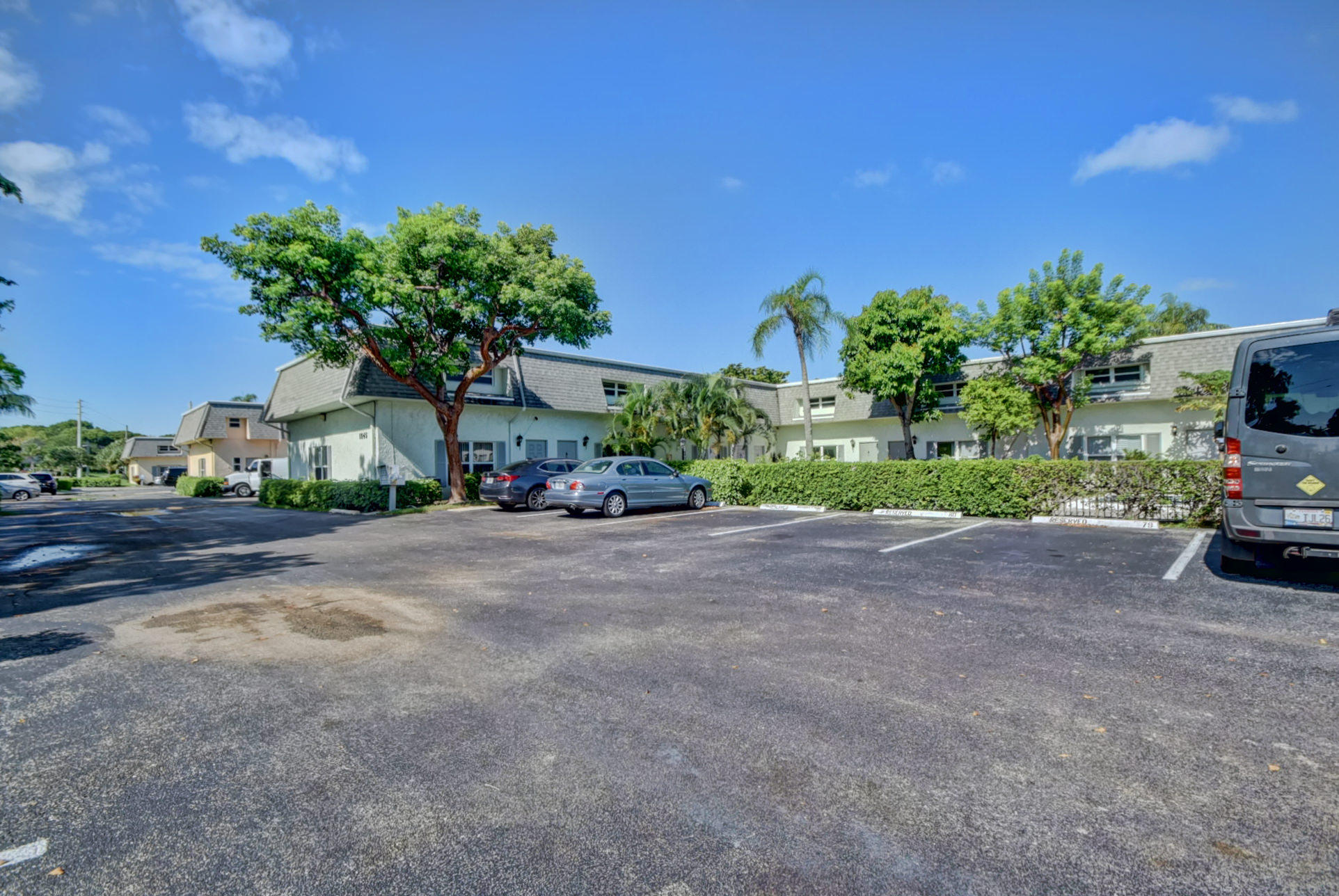 1845 Northwest 4th Avenue, Unit 16 Boca Raton, FL 33432 - Photo 33 of 37 a view of a car park in front of a house