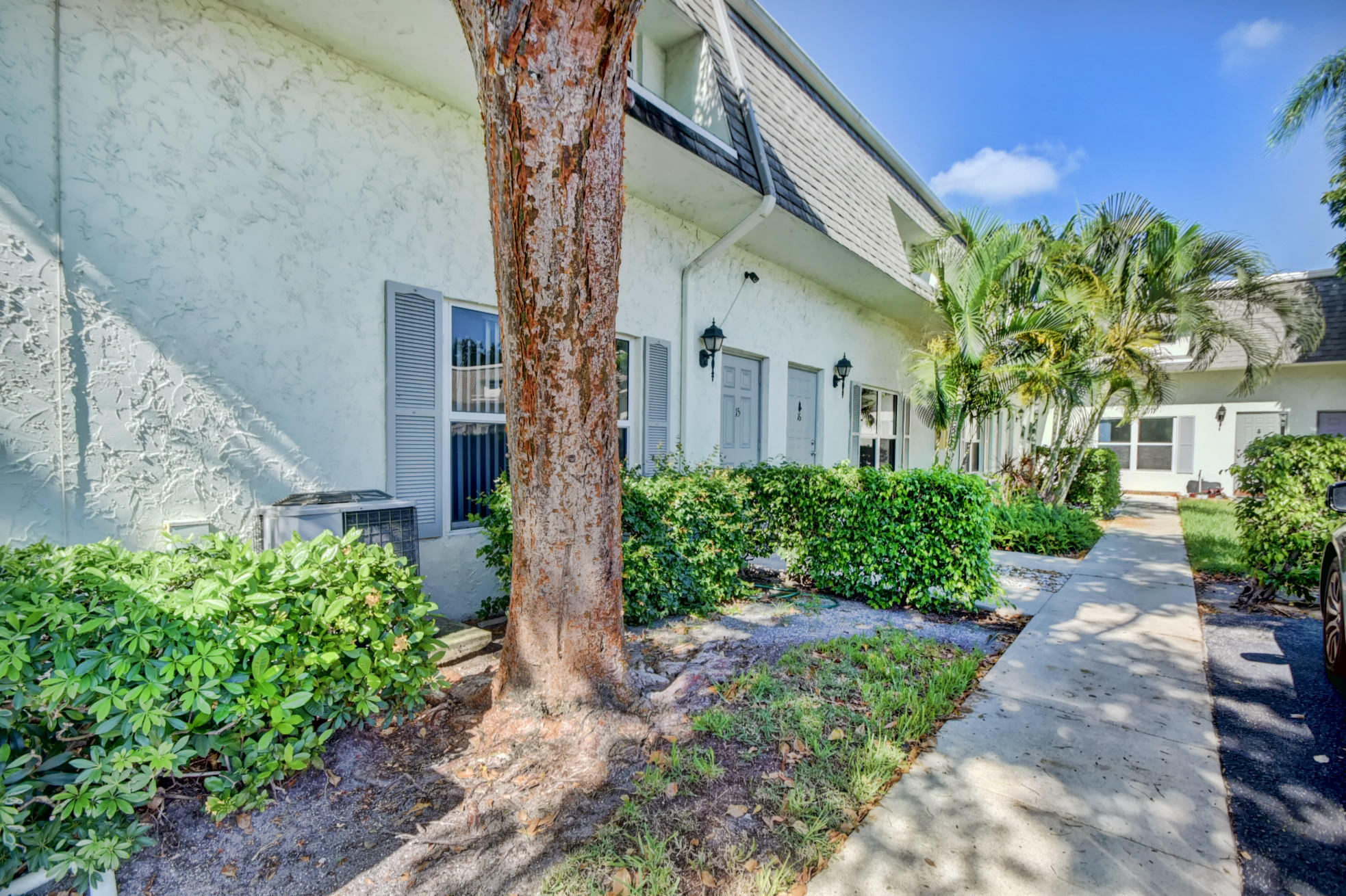 1845 Northwest 4th Avenue, Unit 16 Boca Raton, FL 33432 - Photo 34 of 37 a front view of a house with a yard