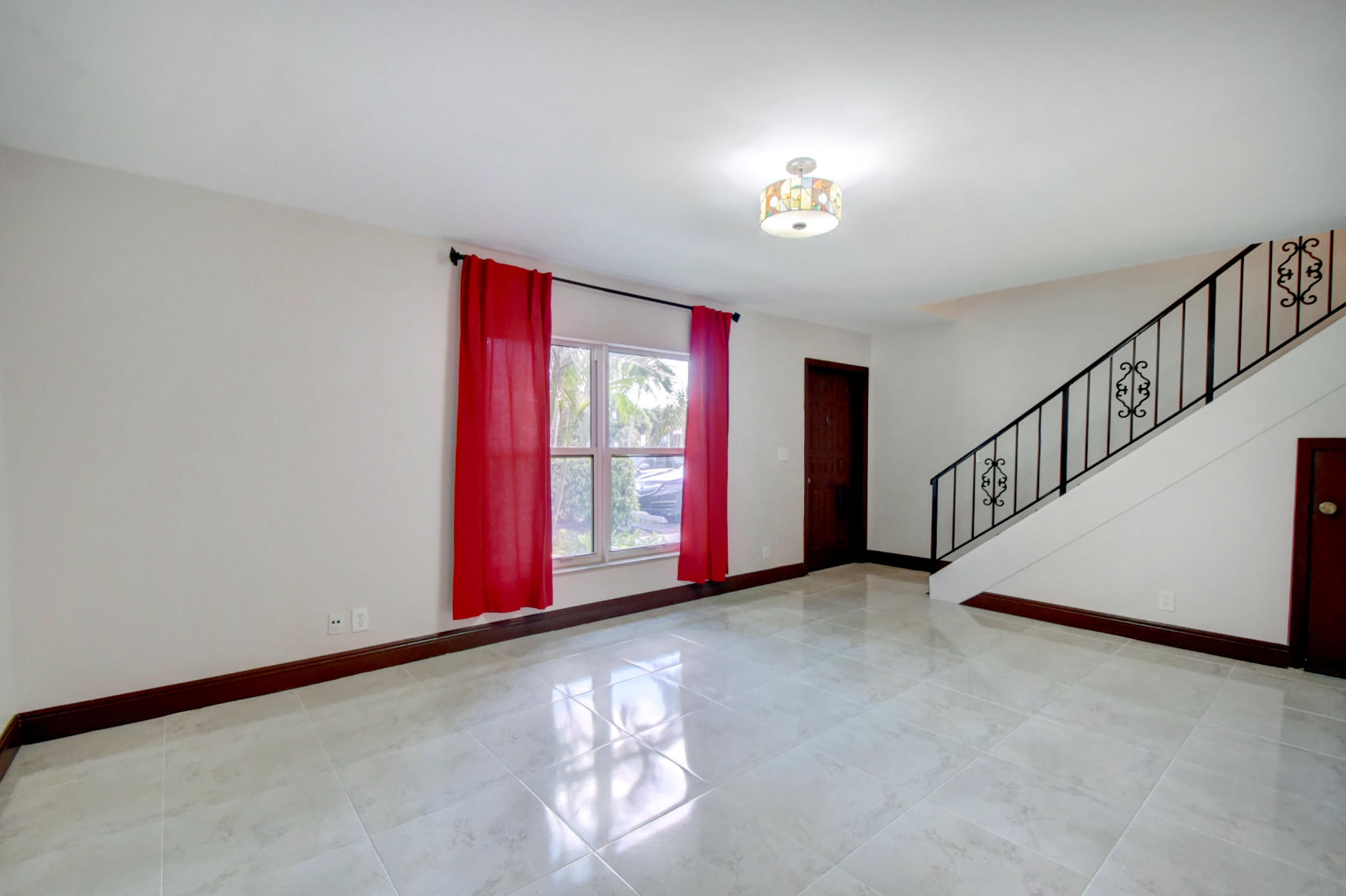 1845 Northwest 4th Avenue, Unit 16 Boca Raton, FL 33432 - Photo 35 of 37 a view of an empty room with a window