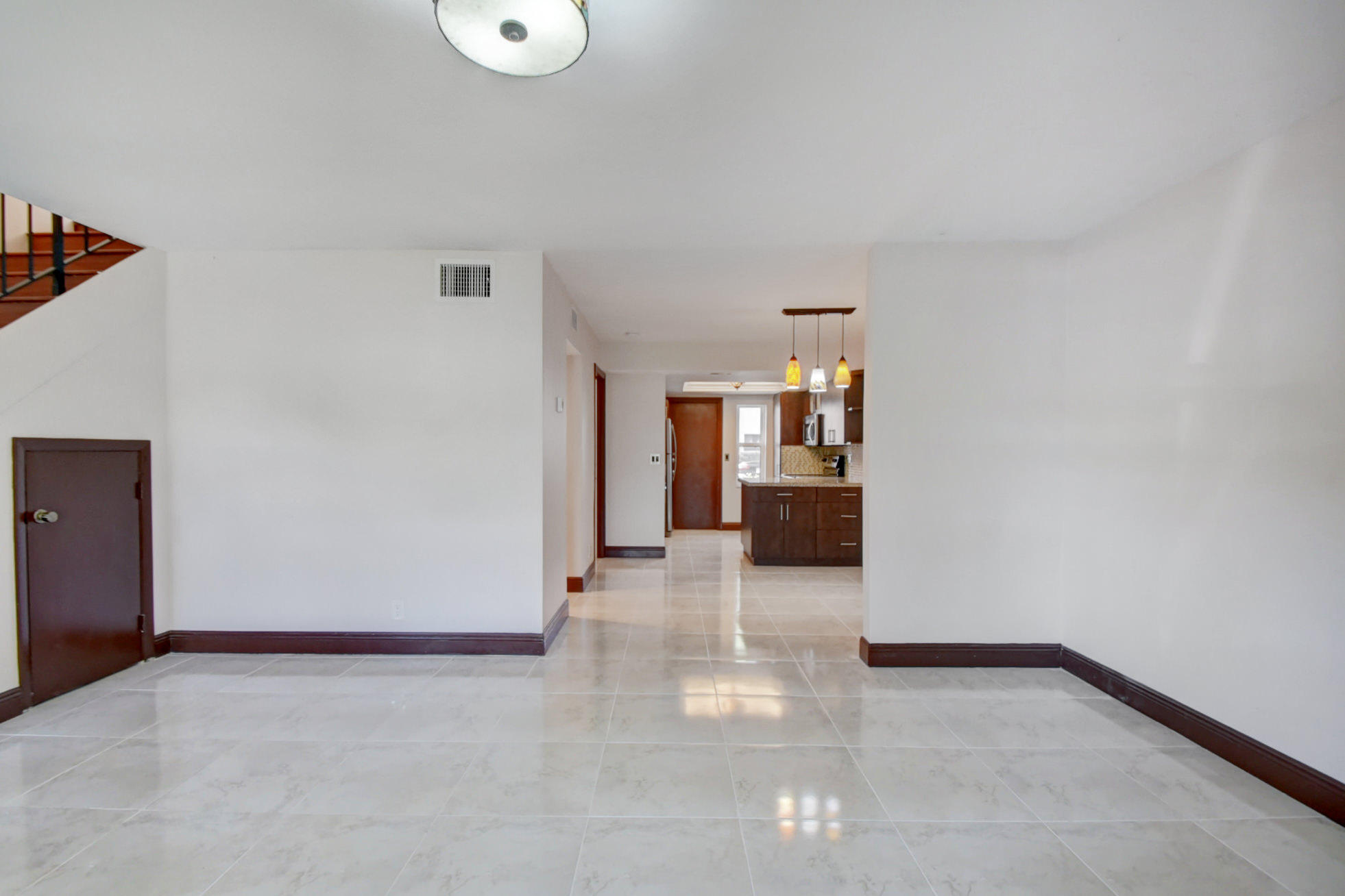 1845 Northwest 4th Avenue, Unit 16 Boca Raton, FL 33432 - Photo 4 of 37 a view of a living room with furniture and wooden floor