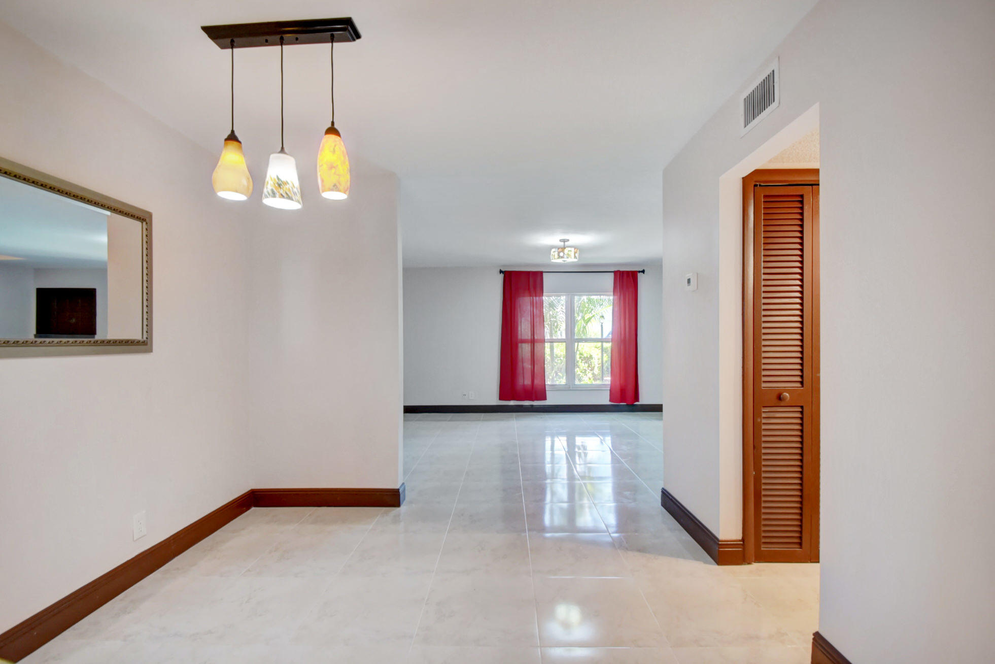 1845 Northwest 4th Avenue, Unit 16 Boca Raton, FL 33432 - Photo 8 of 37 an empty room with windows