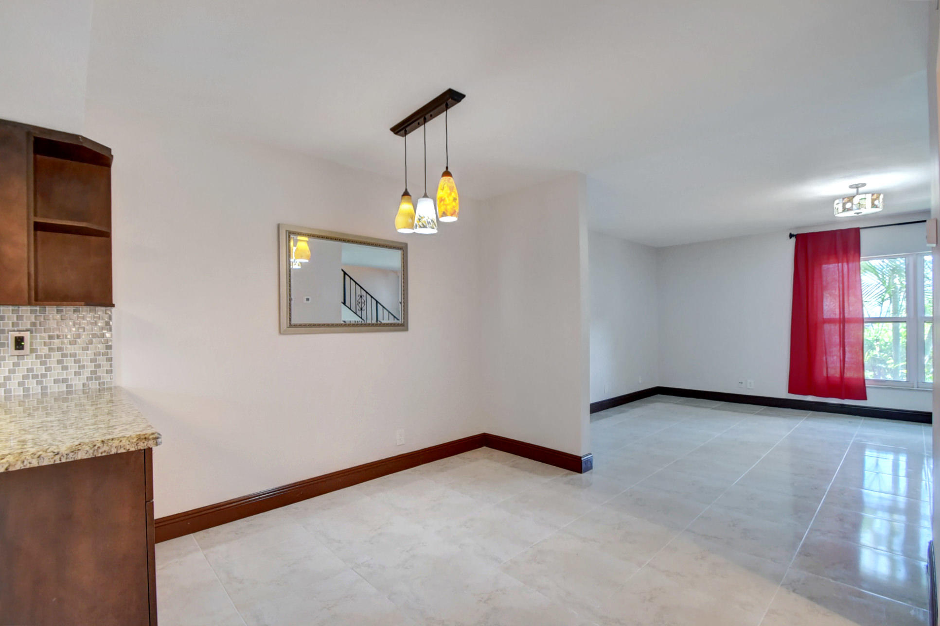 1845 Northwest 4th Avenue, Unit 16 Boca Raton, FL 33432 - Photo 9 of 37 a view of a livingroom with a staircase