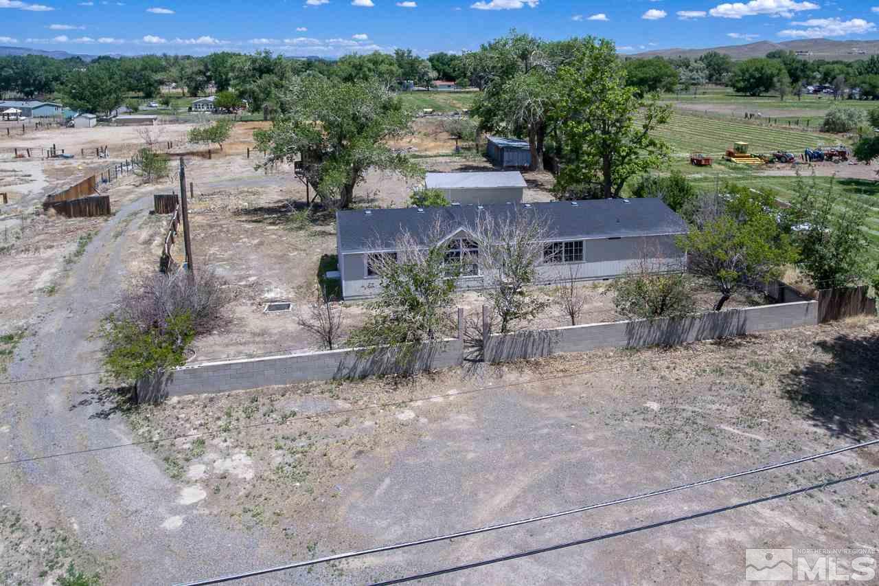 1380 Ricci Lane Fernley, NV 89408 - Photo 16 of 25 an aerial view of a house with yard and ocean view