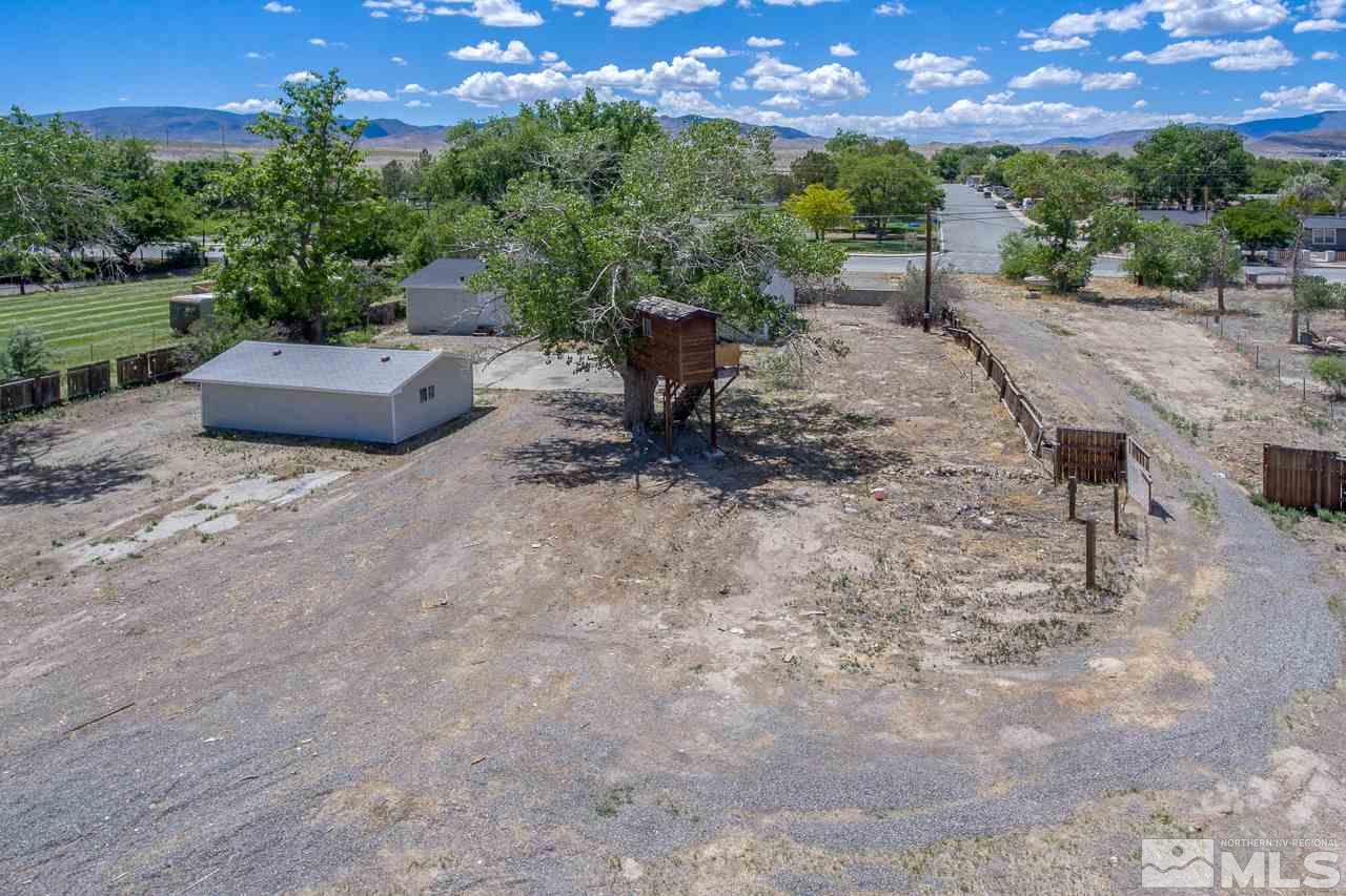 1380 Ricci Lane Fernley, NV 89408 - Photo 18 of 25 a view of a backyard with sitting area