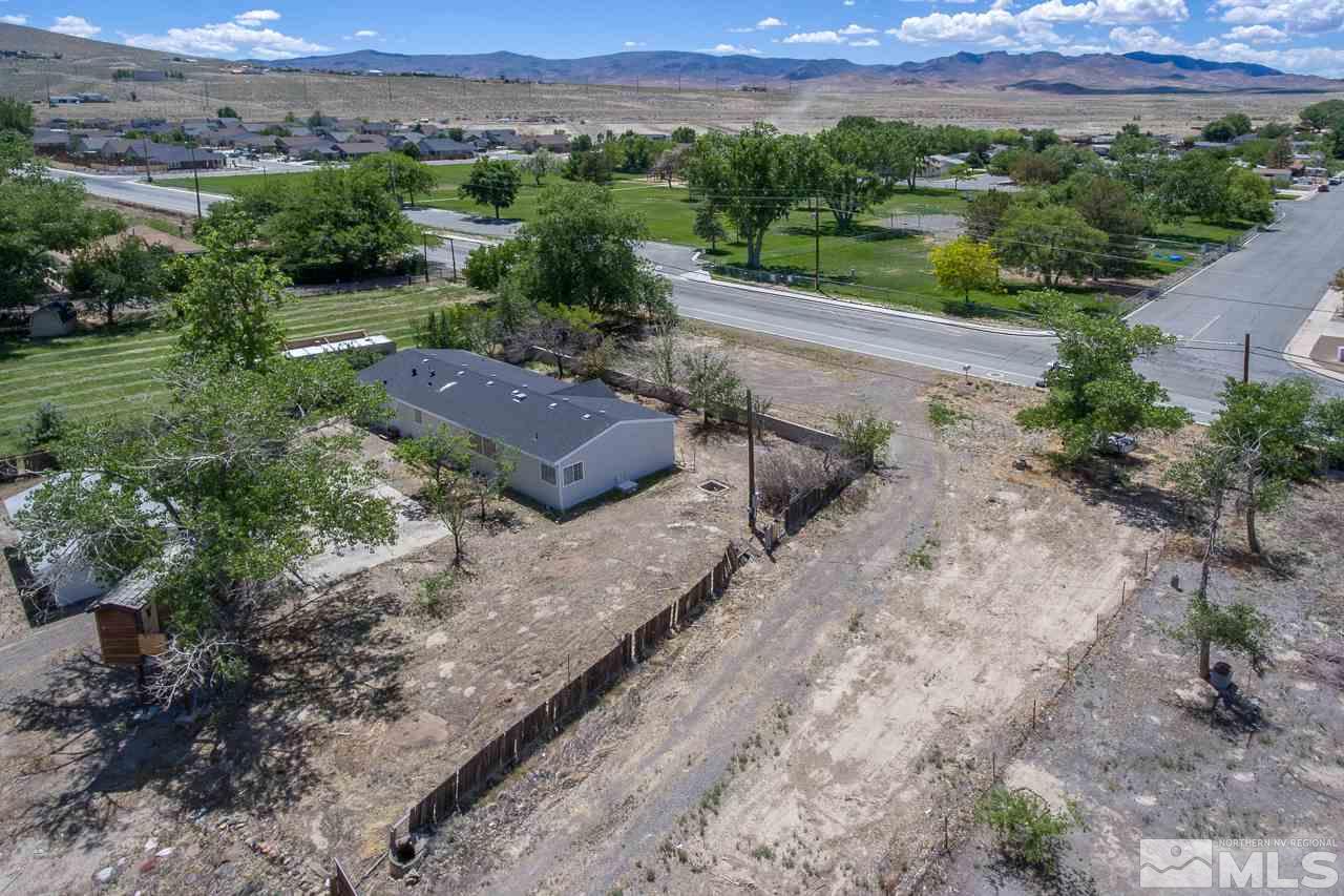 1380 Ricci Lane Fernley, NV 89408 - Photo 19 of 25 an aerial view of a house with a yard