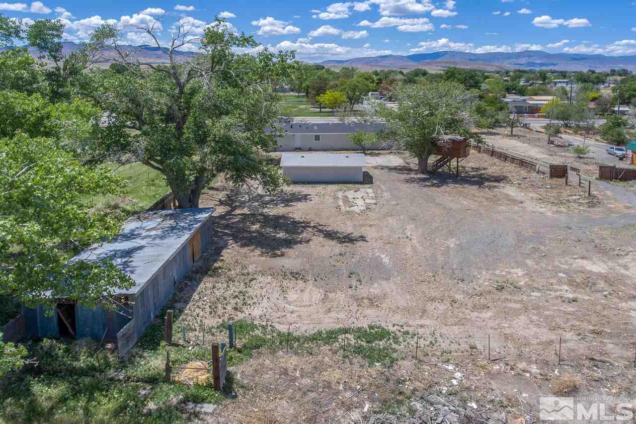 1380 Ricci Lane Fernley, NV 89408 - Photo 20 of 25 a backyard of a house with lots of green space and mountain view