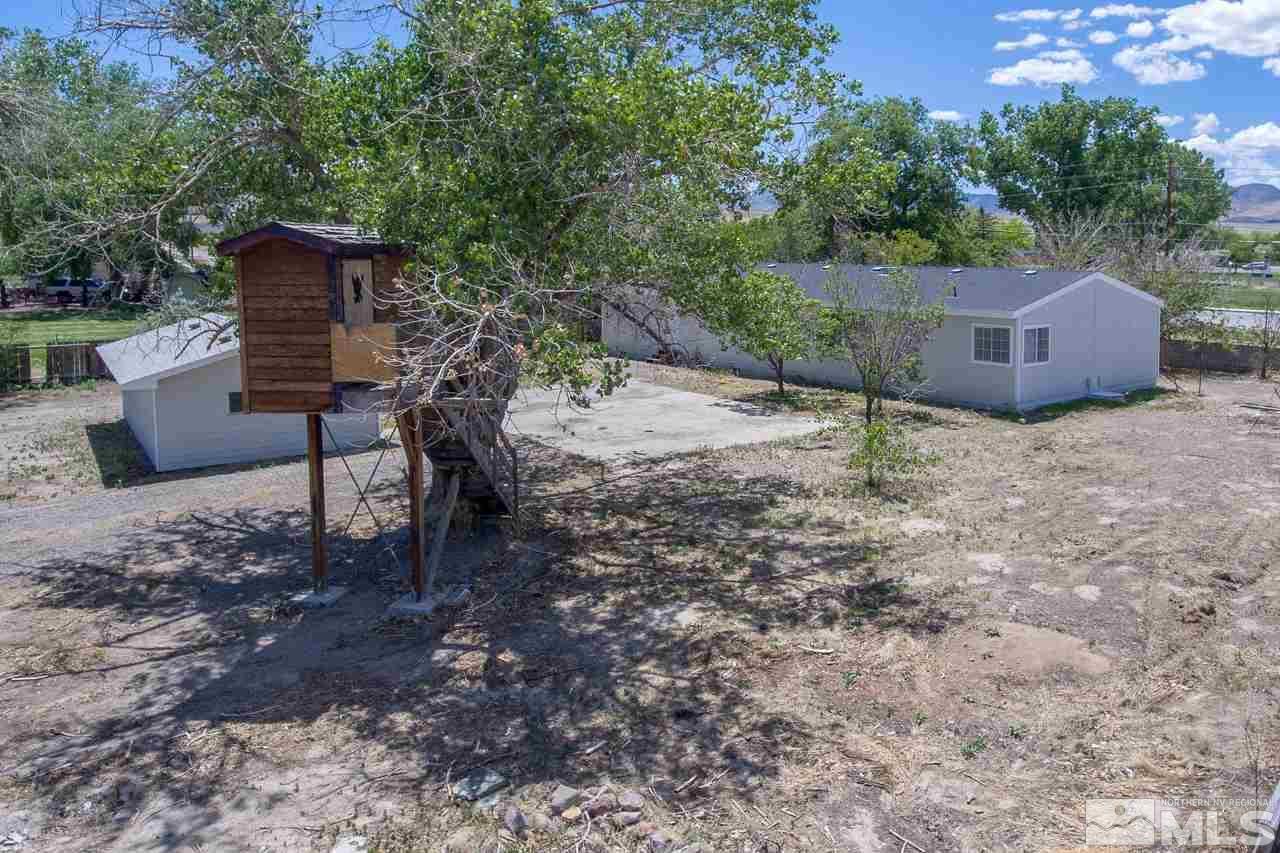 1380 Ricci Lane Fernley, NV 89408 - Photo 2 of 25 a backyard of a house with lots of green space