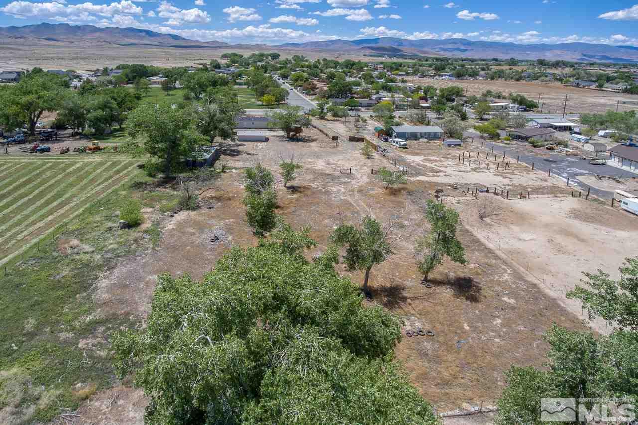 1380 Ricci Lane Fernley, NV 89408 - Photo 22 of 25 a view of a back yard with a street