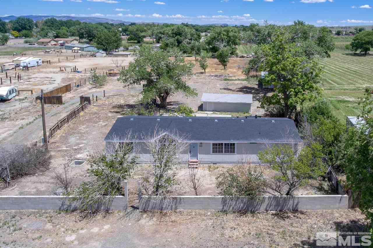 1380 Ricci Lane Fernley, NV 89408 - Photo 24 of 25 an aerial view of a house with a yard