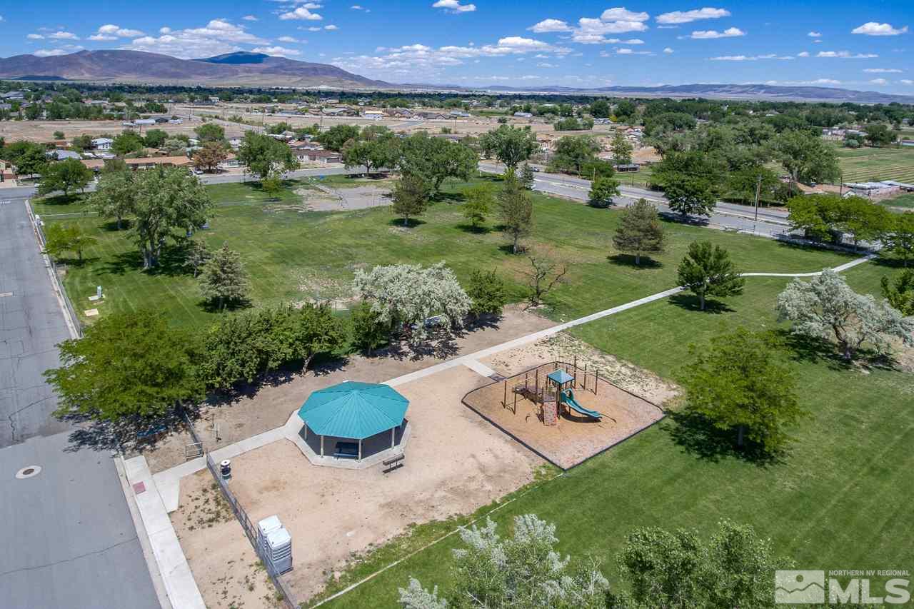 1380 Ricci Lane Fernley, NV 89408 - Photo 25 of 25 a view of a garden with a lake
