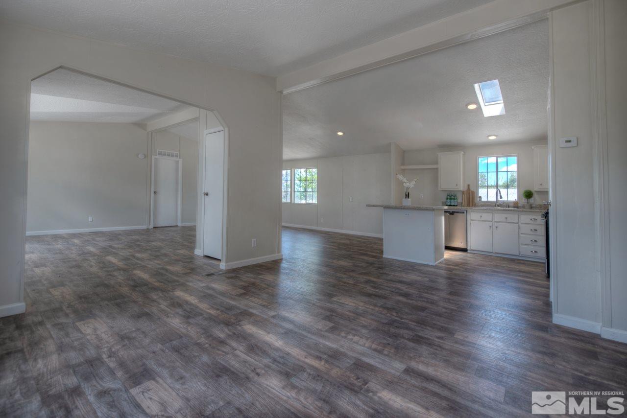 1380 Ricci Lane Fernley, NV 89408 - Photo 6 of 25 a view of a kitchen with a sink and wooden floor